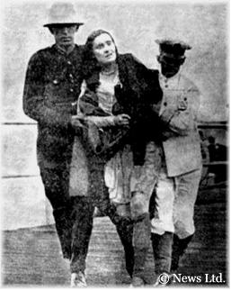 One of the most dramatic photographs to appear in the newspapers at the time was this image of a distraught woman being brought ashore, bedraggled and with her stockings torn.  News Ltd.